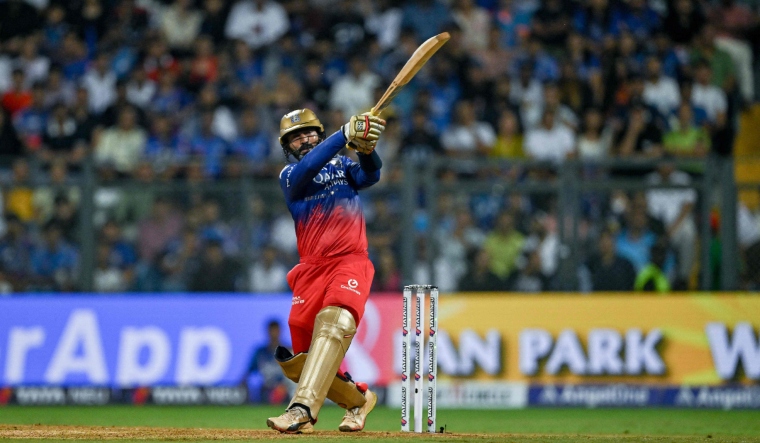 Royal Challengers Bengaluru's Dinesh Karthik plays a shot against Mumbai Indians  AFP